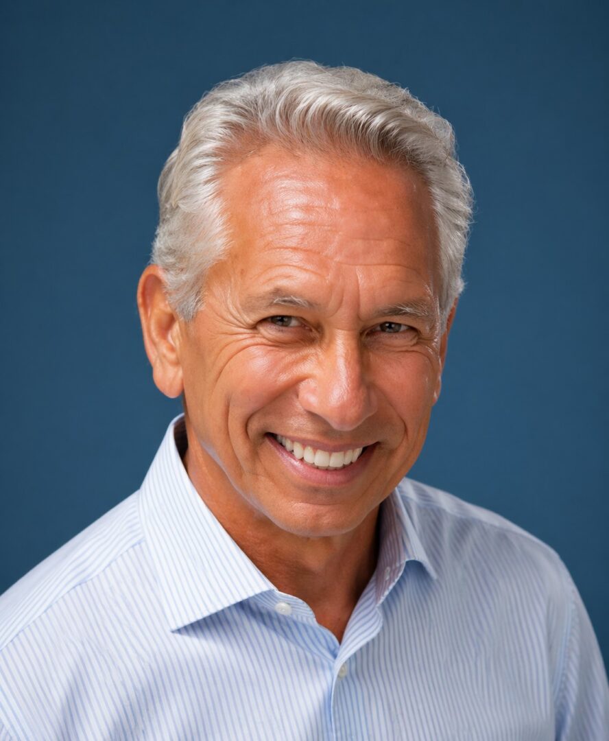 Portrait headshot of smiling older man